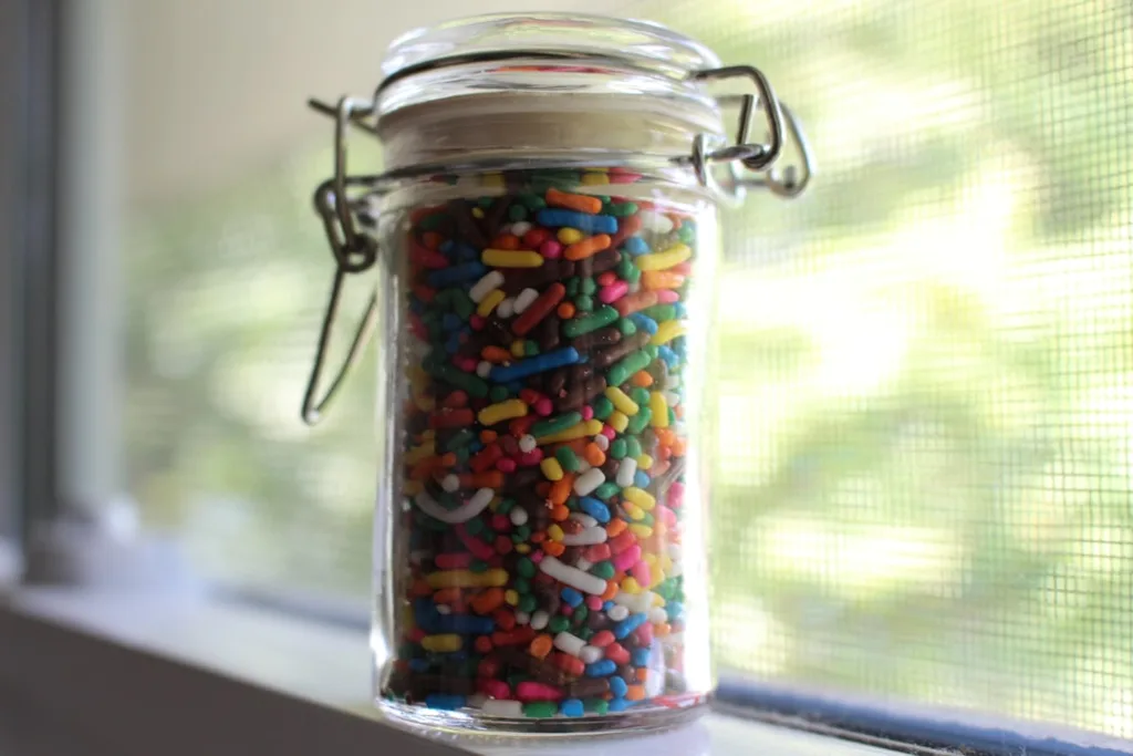 Jar full of rainbow sprinkles