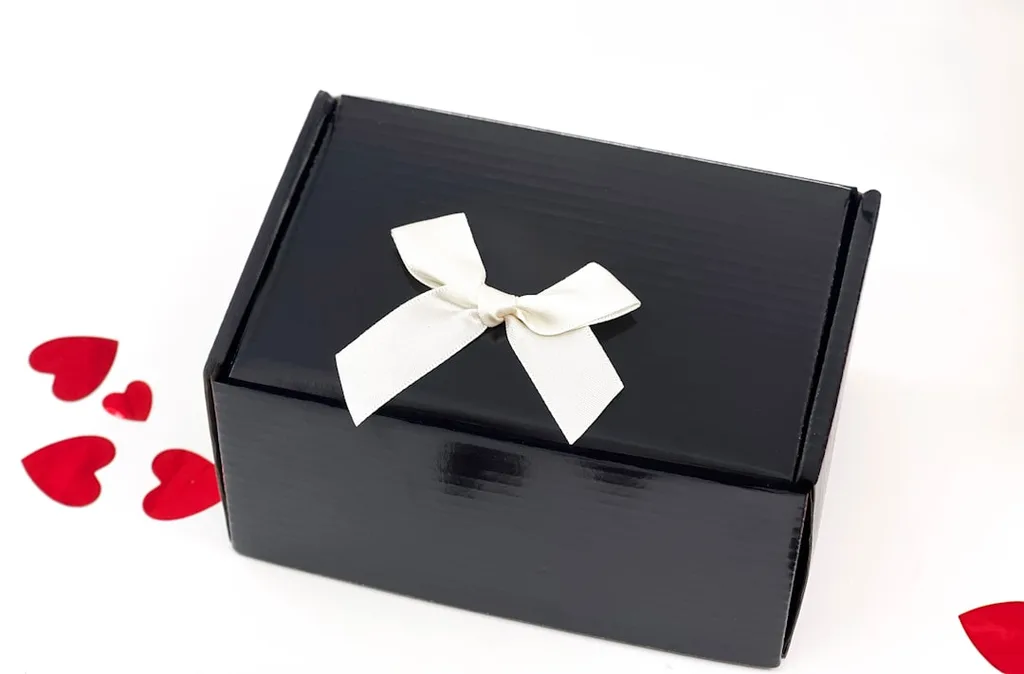 Sleek black gift box with white ribbon